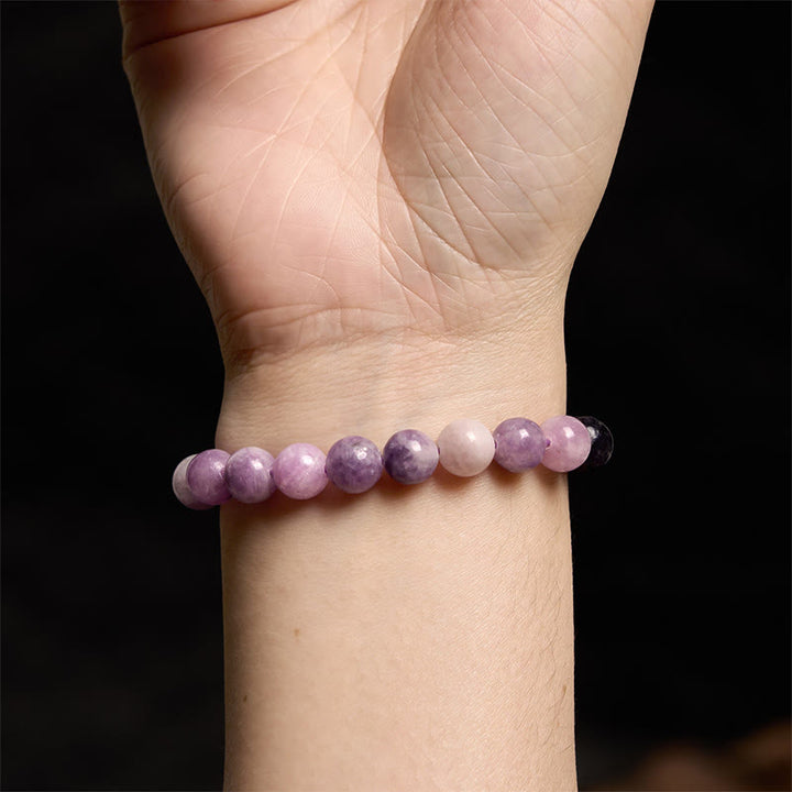 Pulsera positiva con piedra de mica morada y Buddha Stones