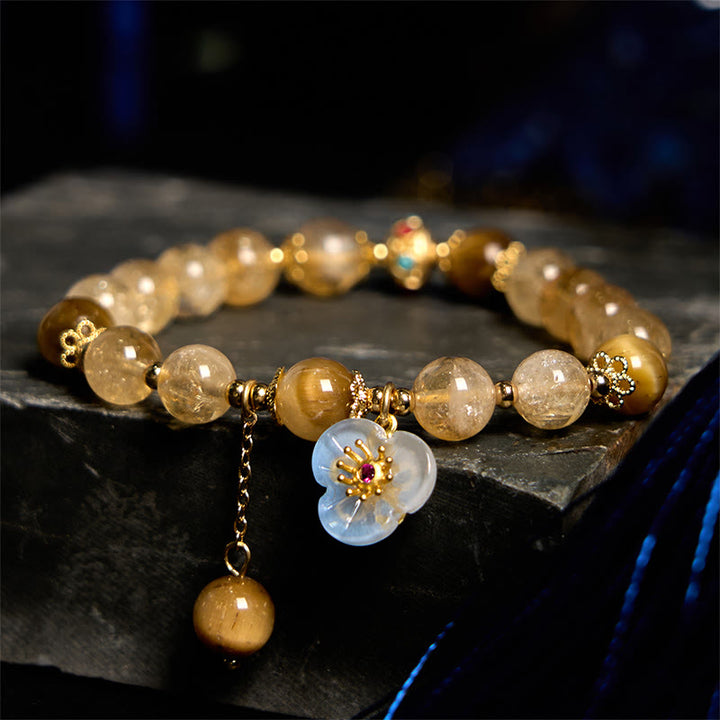 Pulsera de generosidad con dije de flor de ojo de tigre y citrino de Buddha Stones