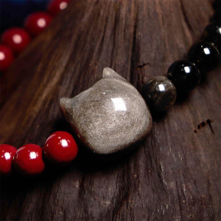 Pulsera de obsidiana negra con Buddha Stones, cinabrio y plata con brillo de gato - image 3
