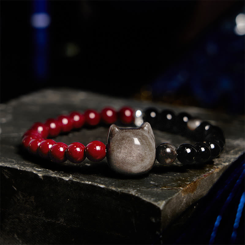 Pulsera de obsidiana negra con Buddha Stones, cinabrio y plata con brillo de gato - image 1