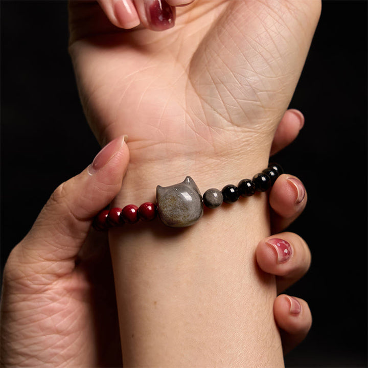 Pulsera de obsidiana negra con Buddha Stones, cinabrio y plata con brillo de gato - image 6