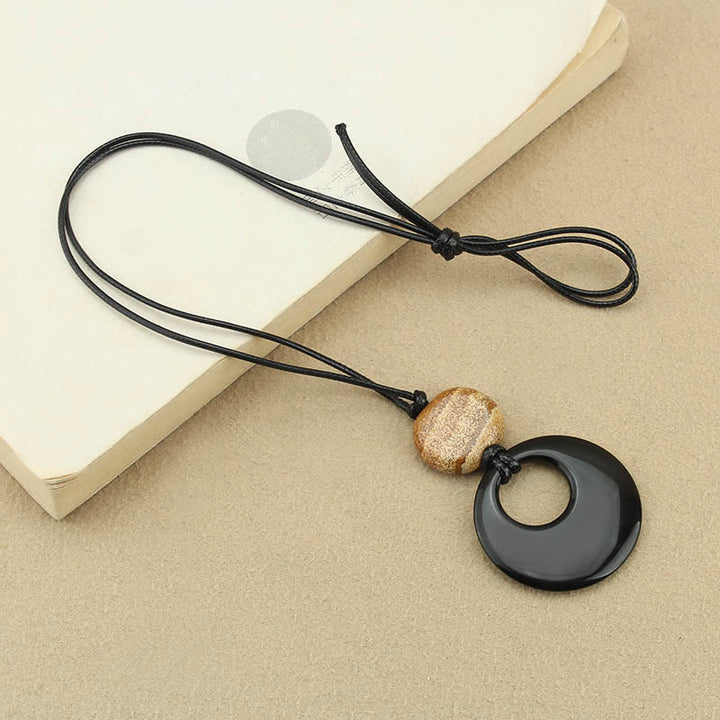 Collar con colgante de cobre con imagen de piedra de Liuli y obsidiana negra de Buddha Stones