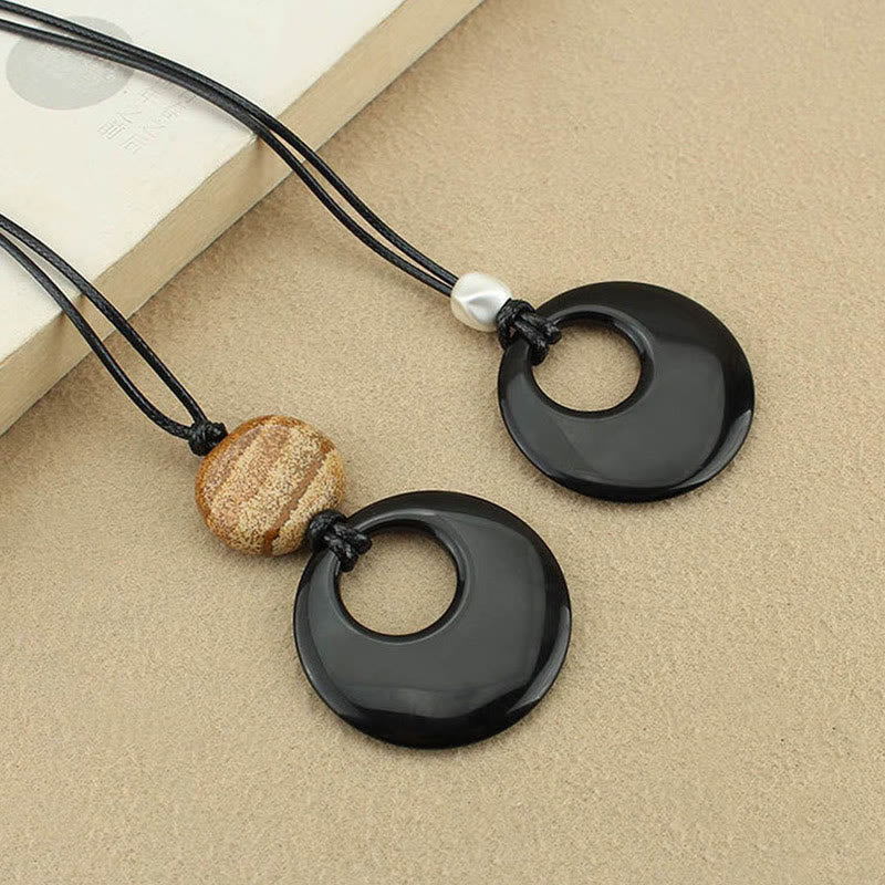 Collar con colgante de cobre con imagen de piedra de Liuli y obsidiana negra de Buddha Stones