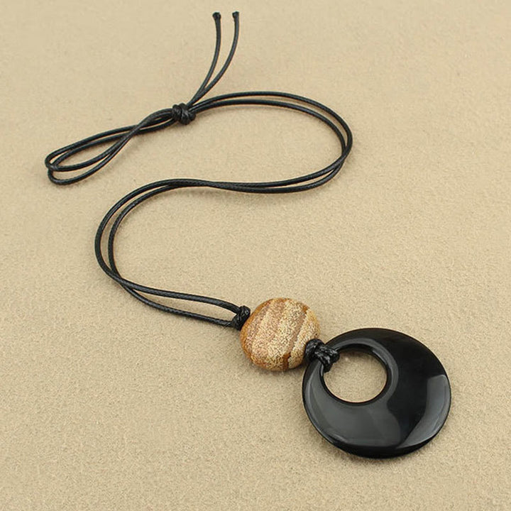Collar con colgante de cobre con imagen de piedra de Liuli y obsidiana negra de Buddha Stones
