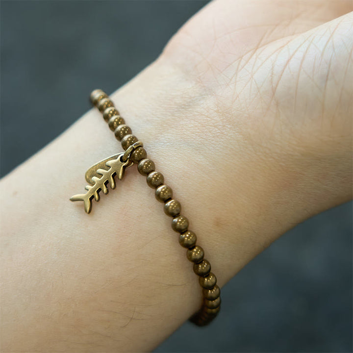 Pulsera curativa de espina de pescado de latón y cobre con Buddha Stones - image 7