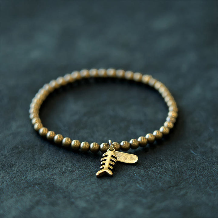 Pulsera curativa de espina de pescado de cobre con Buddha Stones