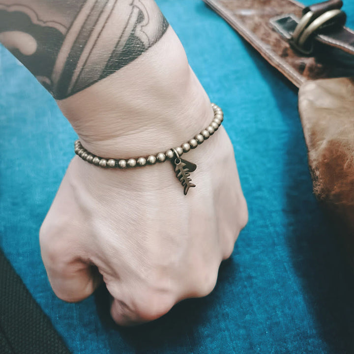 Pulsera curativa de espina de pescado de cobre con Buddha Stones