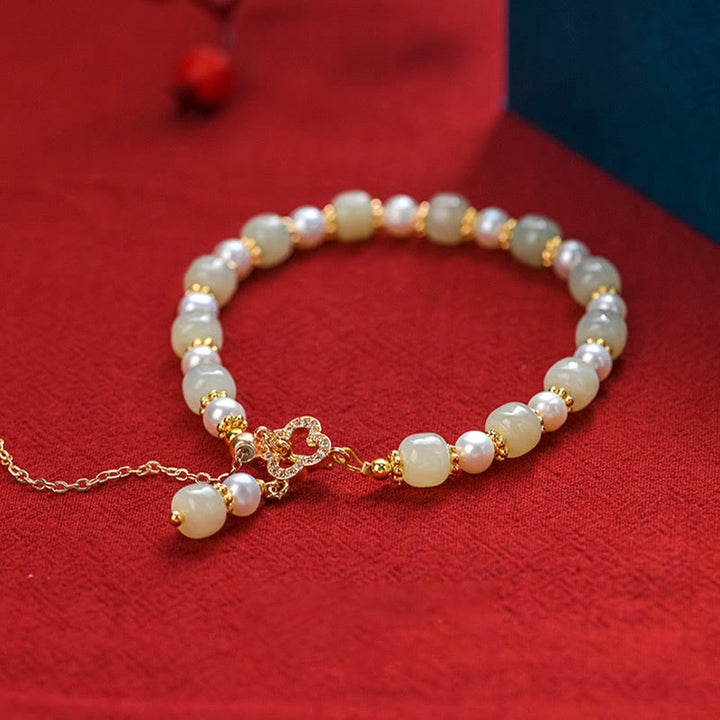Pulsera de la abundancia con colgante de trébol de cuatro hojas de aleación de perla de jade hetiano y Buddha Stones
