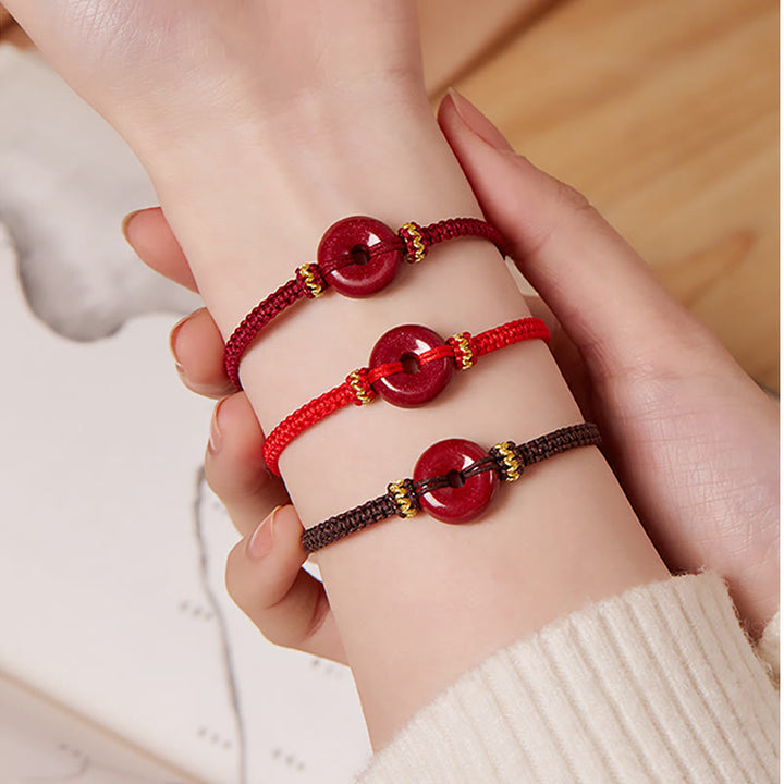 Pulsera trenzada de concentración con hebilla de paz redonda de cinabrio hecha a mano con Buddha Stones