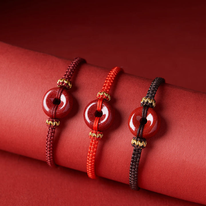 Pulsera trenzada de concentración con hebilla de paz redonda de cinabrio hecha a mano con Buddha Stones