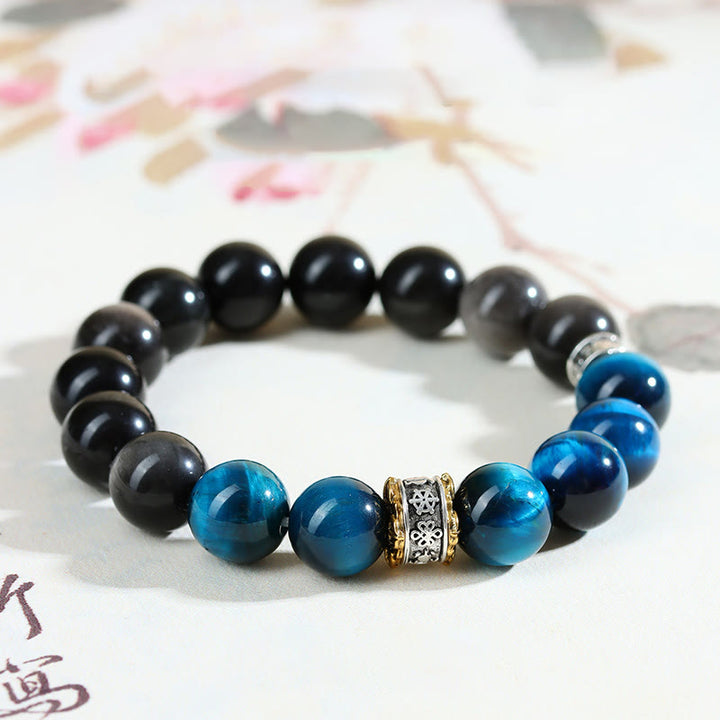 Pulsera de fuerza con obsidiana plateada y ojo de tigre azul y Buddha Stones