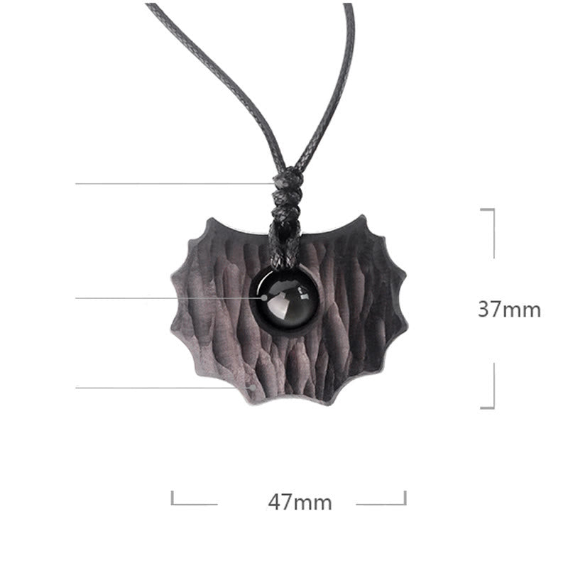 Collar con colgante de paz y calma con forma irregular de obsidiana y madera de ébano y Buddha Stones