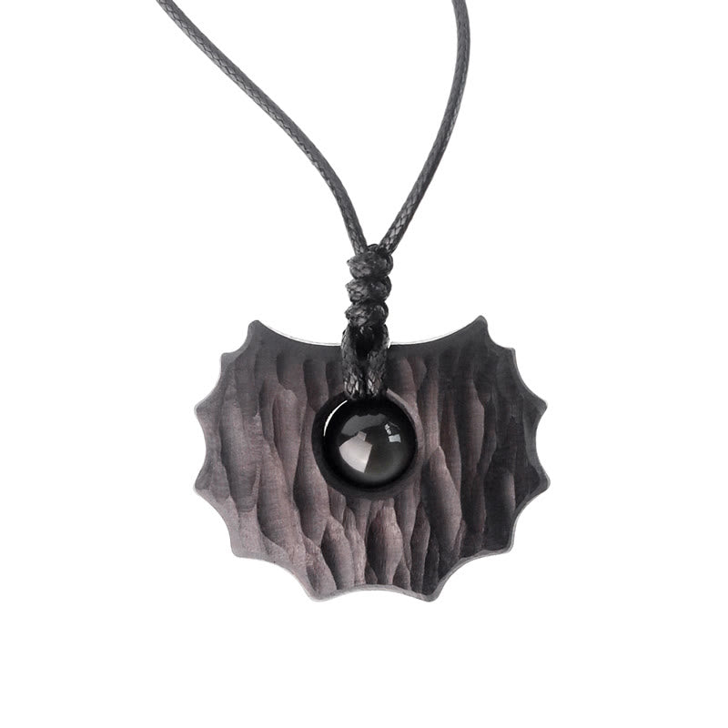 Collar con colgante de paz y calma con forma irregular de obsidiana y madera de ébano y Buddha Stones