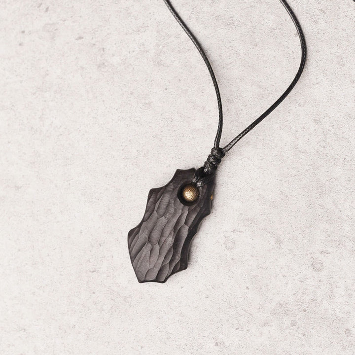 Collar con colgante de paz y calma con cuentas de cobre de forma irregular de madera de ébano y Buddha Stones