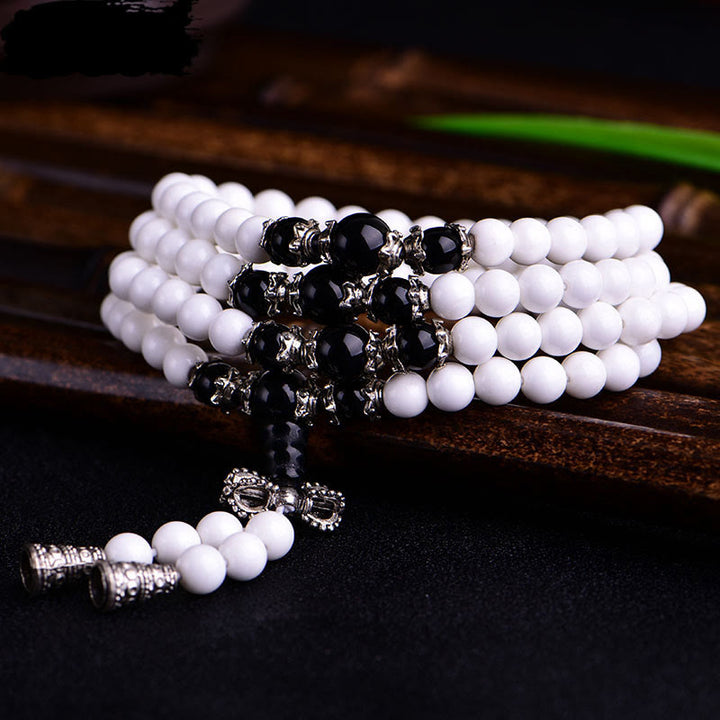 Pulsera de la paciencia con seis palabras verdaderas 'Om Mani Padme Hum' de porcelana blanca con 108 cuentas de Buddha Stones
