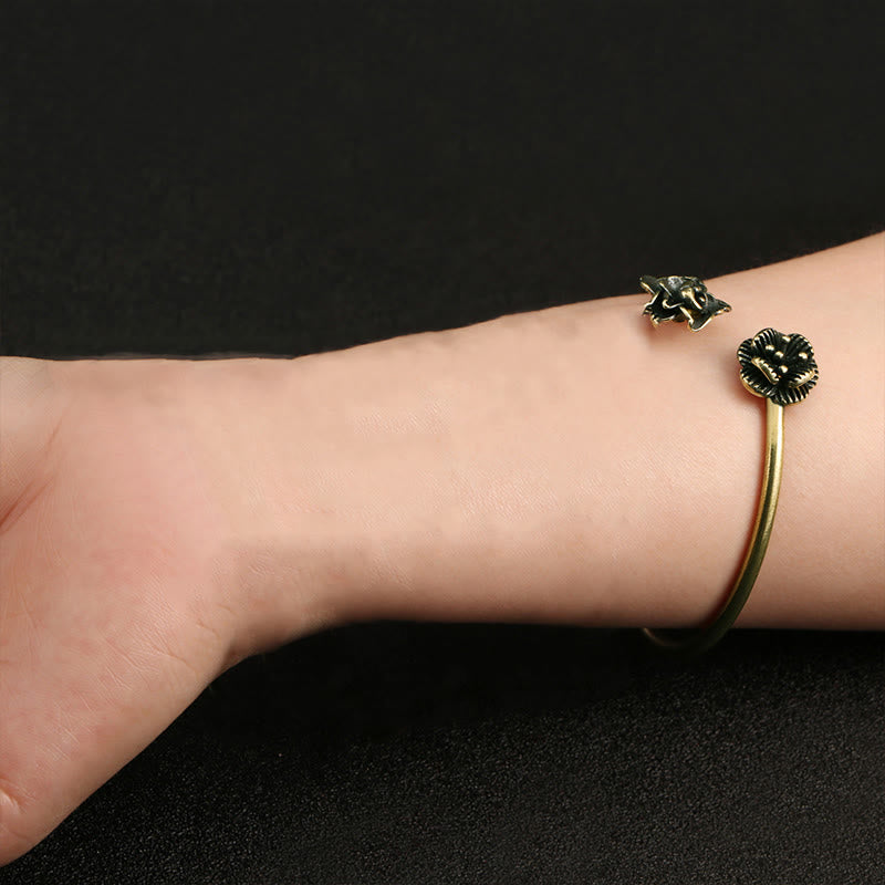 Pulsera curativa de latón y cobre con flores de durazno y Buddha Stones