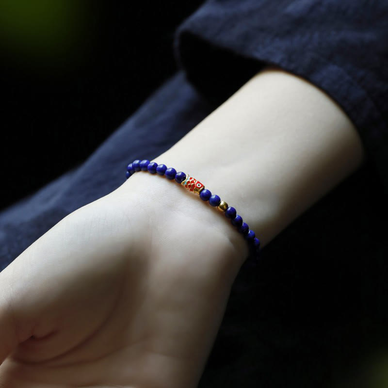 Pulsera positiva con pez koi y lazurita de Buddha Stones