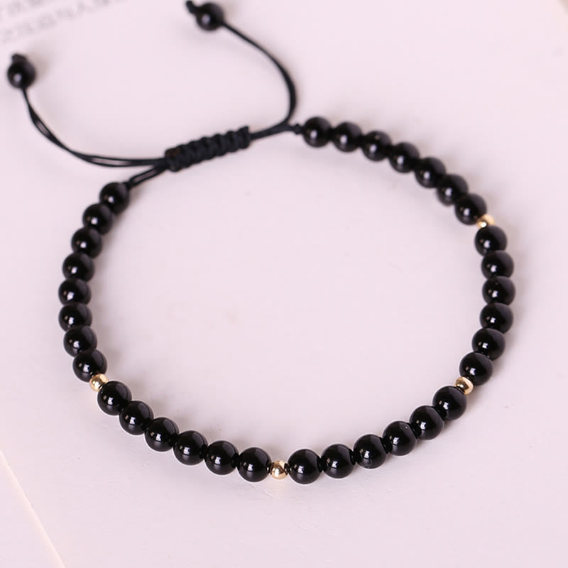 Pulsera de cuerda con cuentas pequeñas de obsidiana negra y Buddha Stones