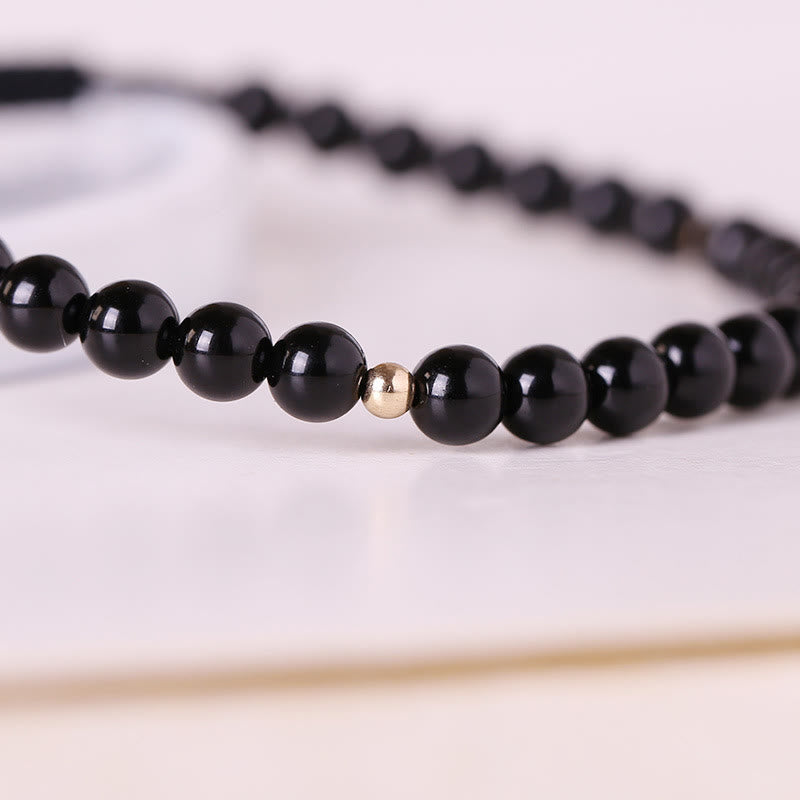 Pulsera de cuerda con cuentas pequeñas de obsidiana negra y Buddha Stones