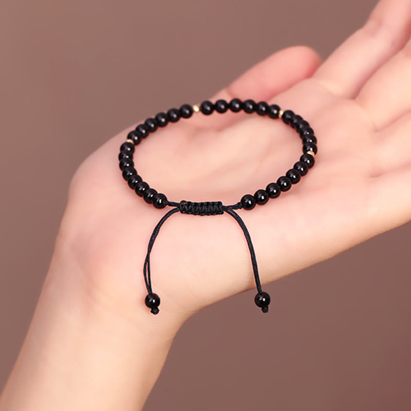 Pulsera de cuerda con cuentas pequeñas de obsidiana negra y Buddha Stones