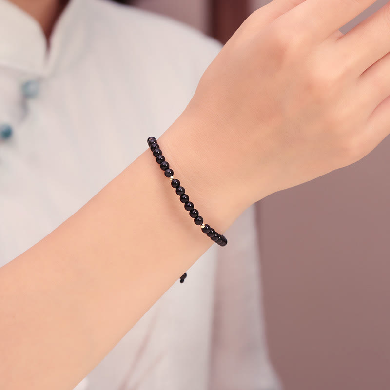Pulsera de cuerda con cuentas pequeñas de obsidiana negra y Buddha Stones