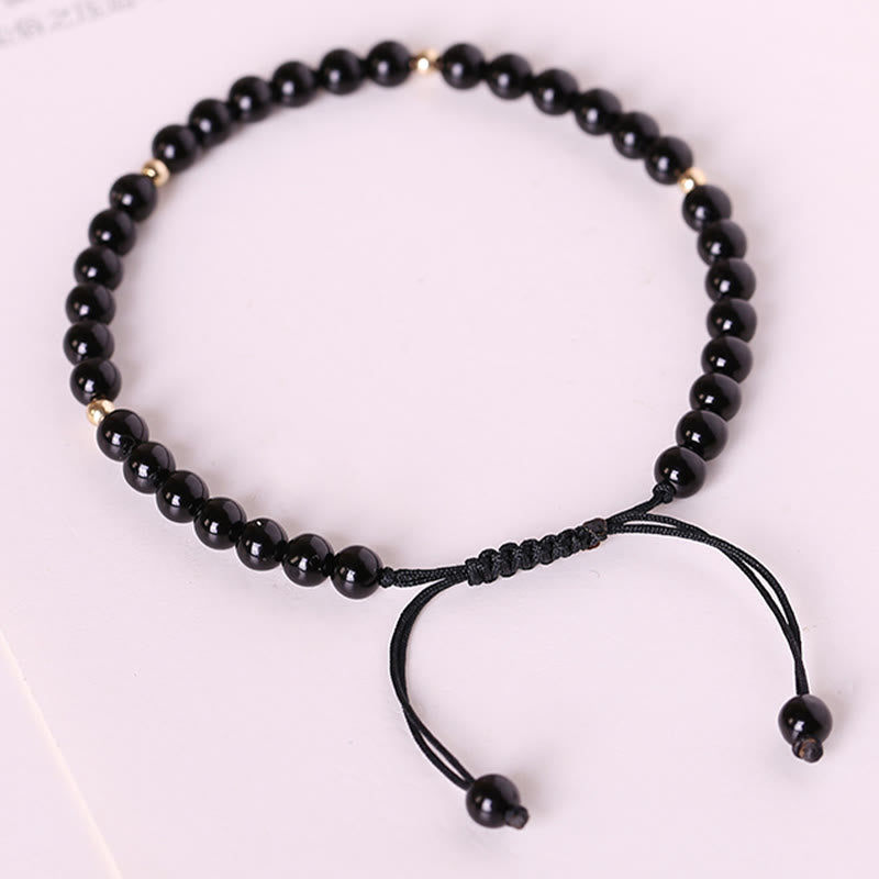 Pulsera de cuerda con cuentas pequeñas de obsidiana negra y Buddha Stones