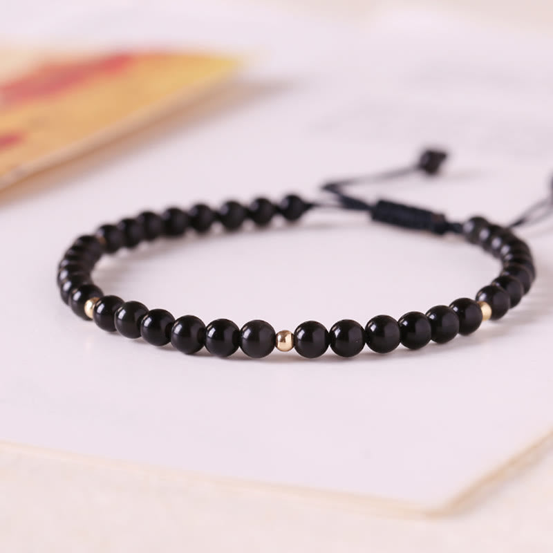 Pulsera de cuerda con cuentas pequeñas de obsidiana negra y Buddha Stones
