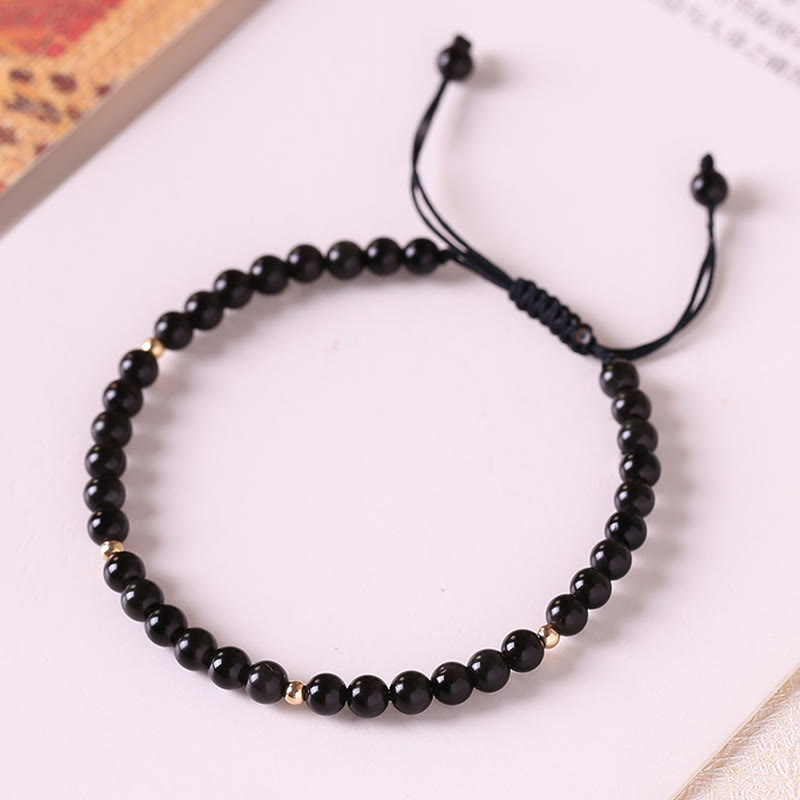 Pulsera de cuerda con cuentas pequeñas de obsidiana negra y Buddha Stones