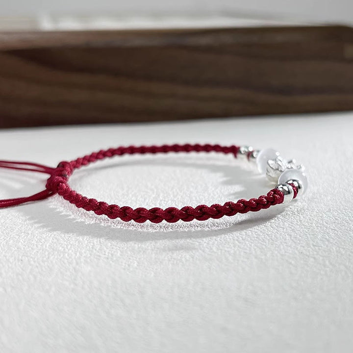 Pulsera de hilo de protección con cuentas de ojo de gato y diseño de loto en plata de ley 999 con Buddha Stones