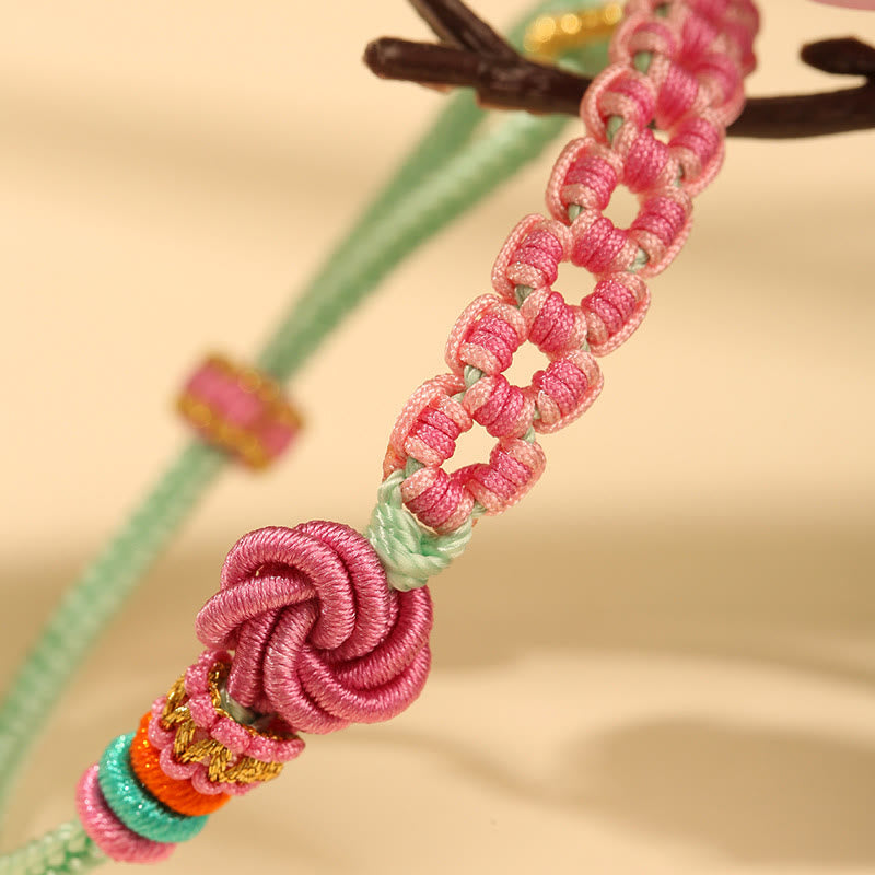 Pulsera trenzada con nudo de flor de durazno verde y rosa hecha a mano con Buddha Stones