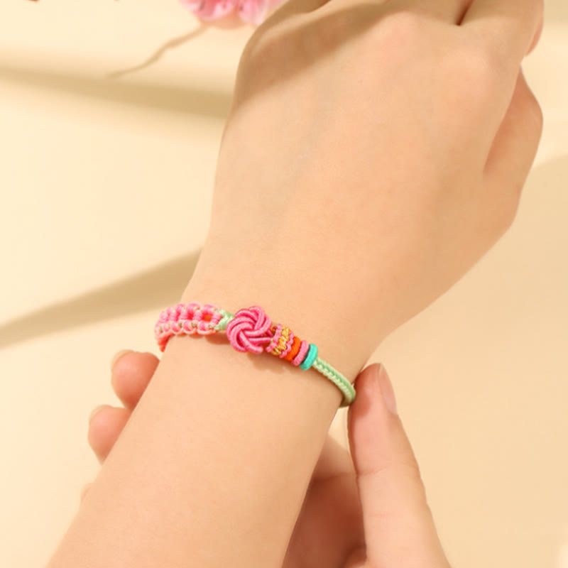 Pulsera trenzada con nudo de flor de durazno verde y rosa hecha a mano con Buddha Stones