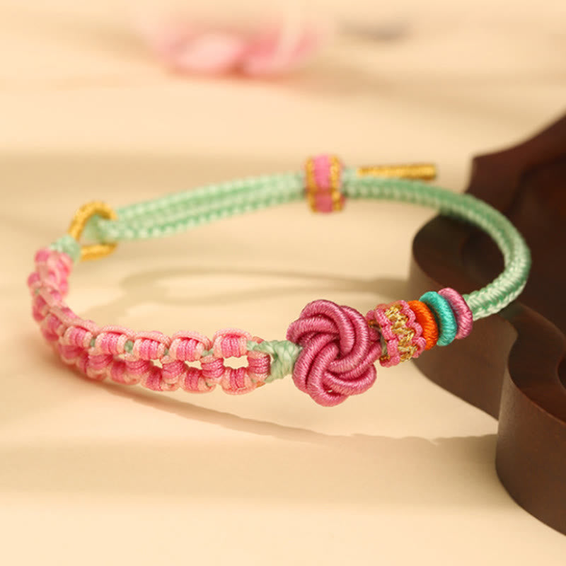 Pulsera trenzada con nudo de flor de durazno verde y rosa hecha a mano con Buddha Stones