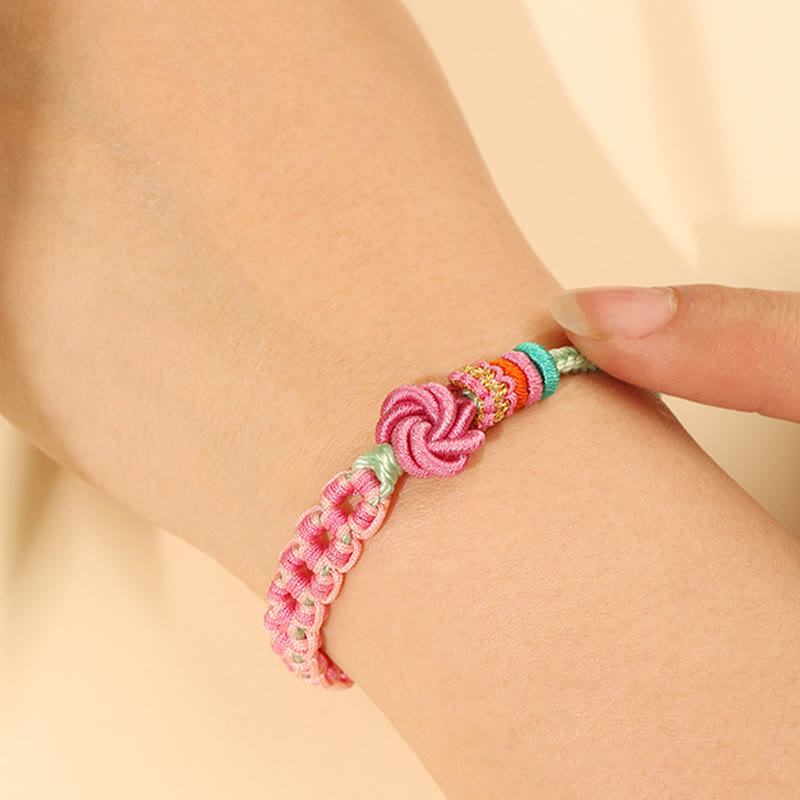 Pulsera trenzada con nudo de flor de durazno verde y rosa hecha a mano con Buddha Stones