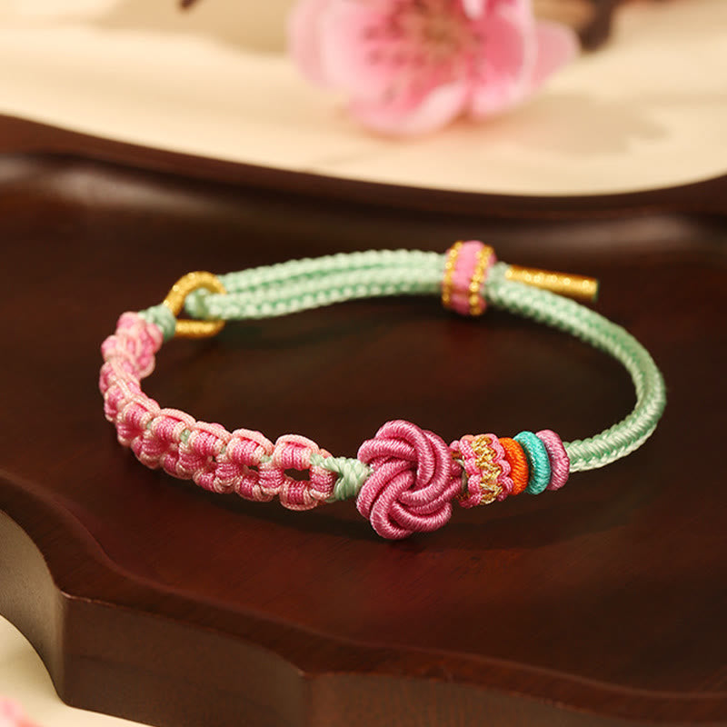 Pulsera trenzada con nudo de flor de durazno verde y rosa hecha a mano con Buddha Stones