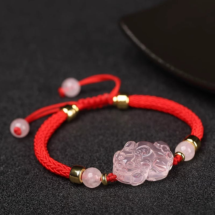Pulsera trenzada de cristal rosa PiXiu con Buddha Stones