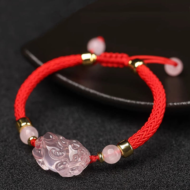 Pulsera trenzada de cristal rosa PiXiu con Buddha Stones