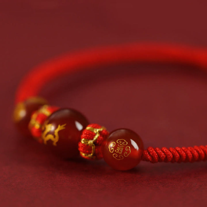 Pulsera trenzada de protección con hilo rojo del zodíaco chino y ágata roja hecha a mano con Buddha Stones