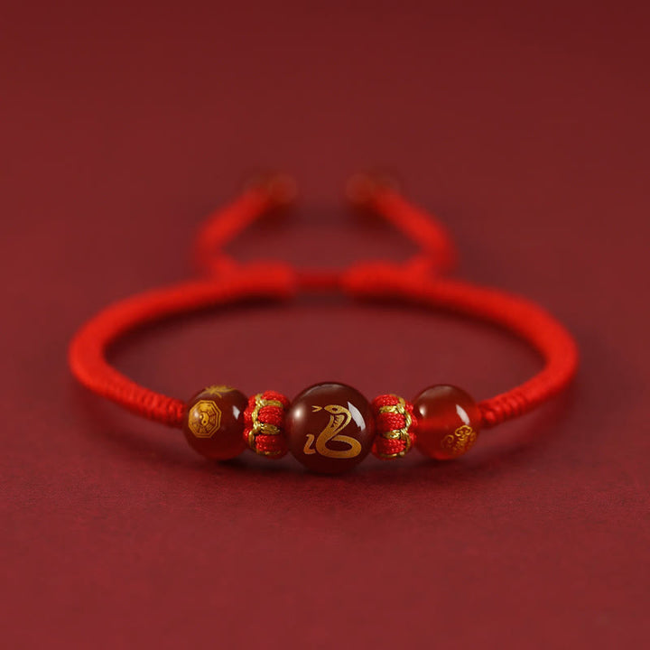 Pulsera trenzada de protección con hilo rojo del zodíaco chino y ágata roja hecha a mano con Buddha Stones