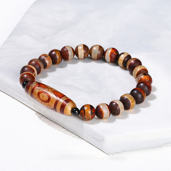 Pulsera de protección de energía con Buddha Stones de nueve ojos tibetanas de sándalo natural y ágata de ojo de gato blanca