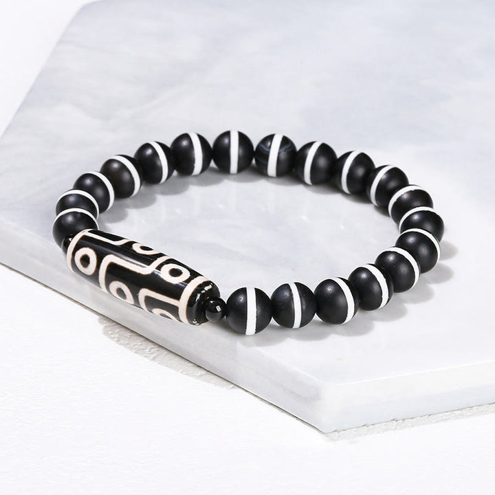 Pulsera de protección de energía con Buddha Stones de nueve ojos tibetanas de sándalo natural y ágata de ojo de gato blanca