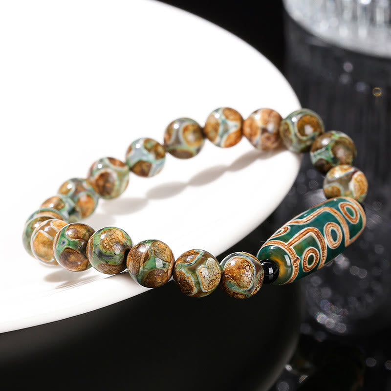 Pulsera de protección de energía con Buddha Stones de nueve ojos tibetanas de sándalo natural y ágata de ojo de gato blanca