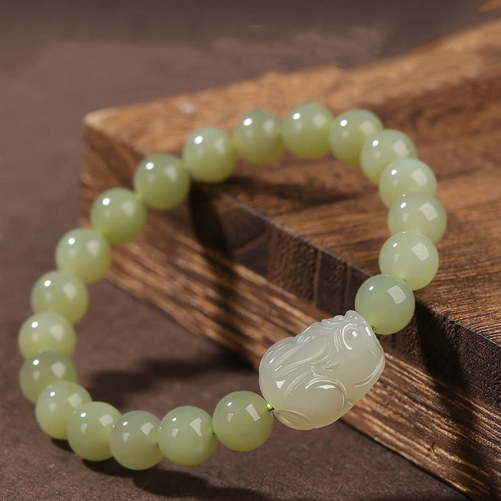 Buddha Stones Pulsera de la suerte tallada en jade PiXiu de Hetian natural