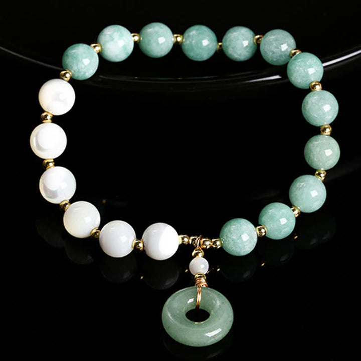 Pulsera con dije de paz y hebilla de caracol, herradura, trochus y Buddha Stones