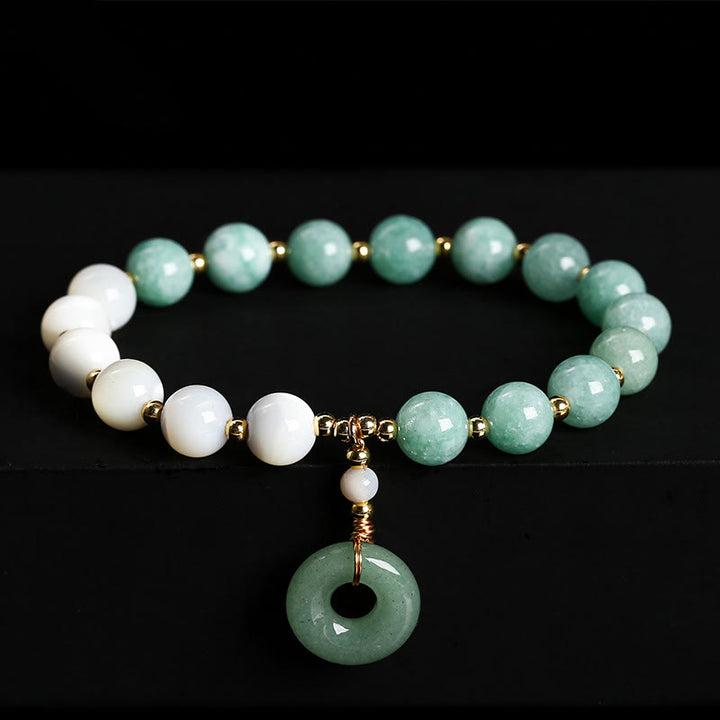 Pulsera con dije de paz y hebilla de caracol, herradura, trochus y Buddha Stones