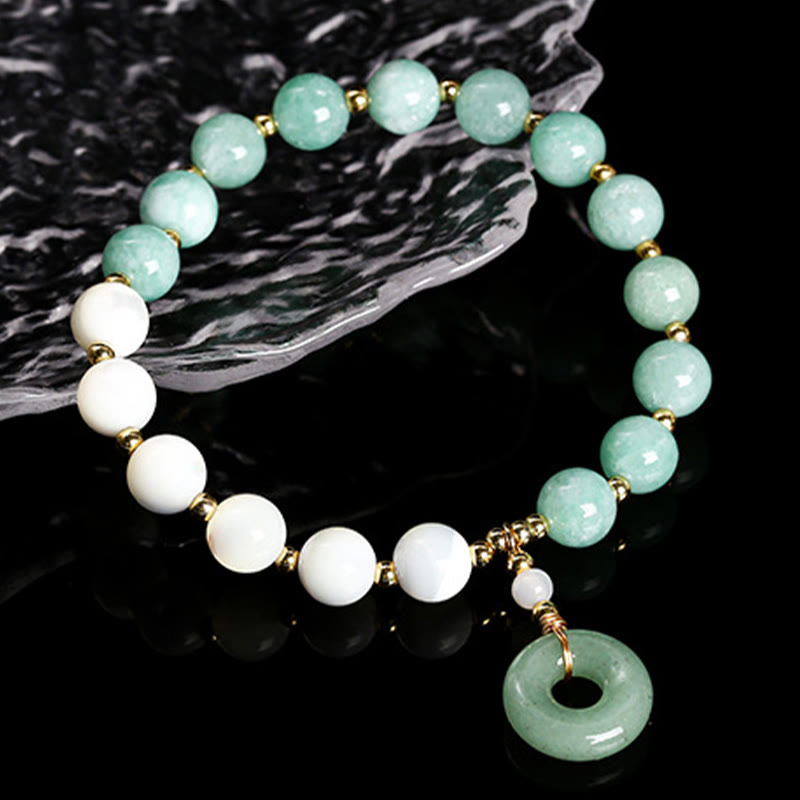 Pulsera con dije de paz y hebilla de caracol, herradura, trochus y Buddha Stones