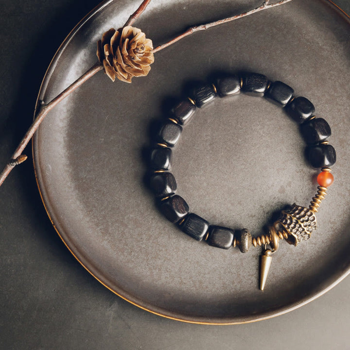 Pulsera de la paz con Buddha Stones, ébano, madera, cobre, latón y ágata roja