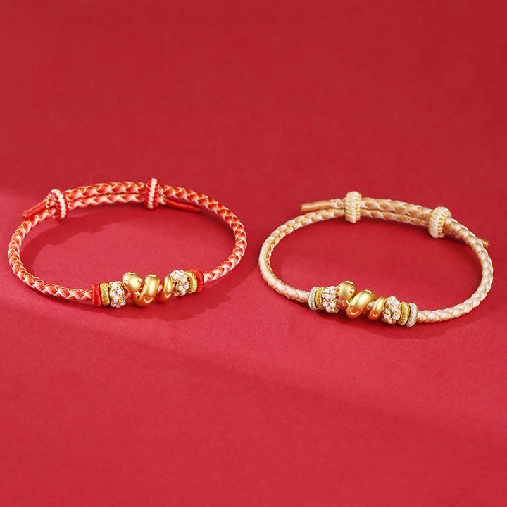 Pulsera trenzada con hilo rojo degradado y Buddha Stones en plata de ley 999 con el año de la serpiente y la suerte