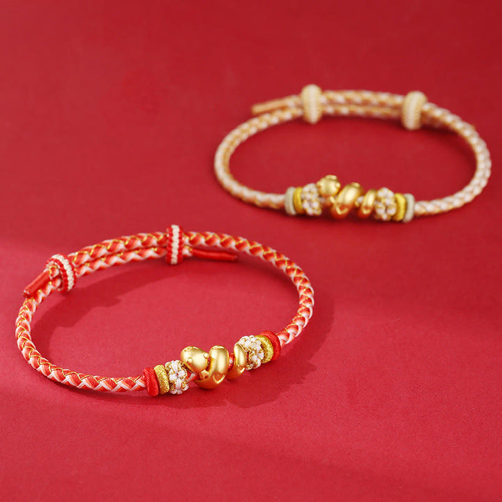 Pulsera trenzada con hilo rojo degradado y Buddha Stones en plata de ley 999 con el año de la serpiente y la suerte