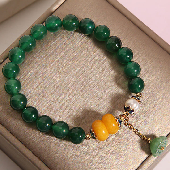Pulsera de soporte con vaina de loto, ámbar, perla y ágata verde de Buddha Stones