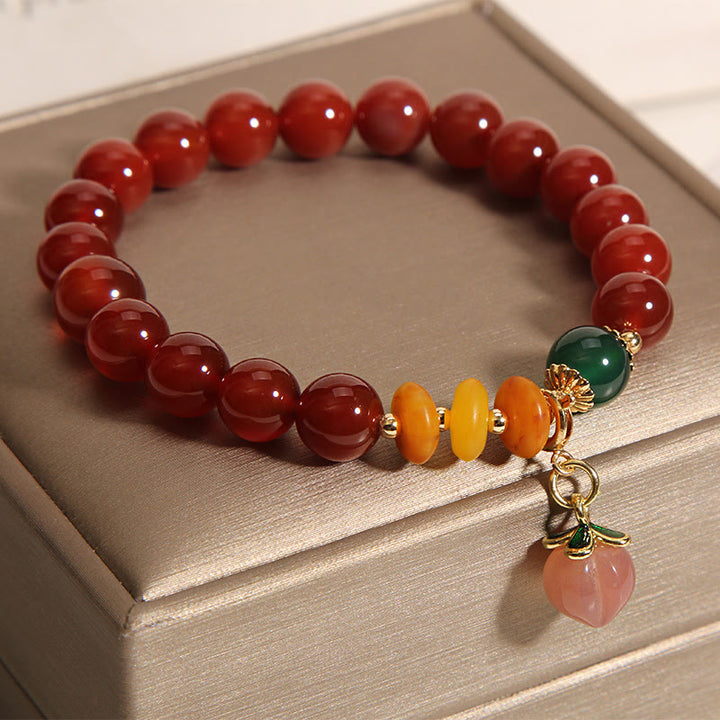 Pulsera de autoaceptación con dijes de melocotón, ámbar y ágata roja de Buddha Stones